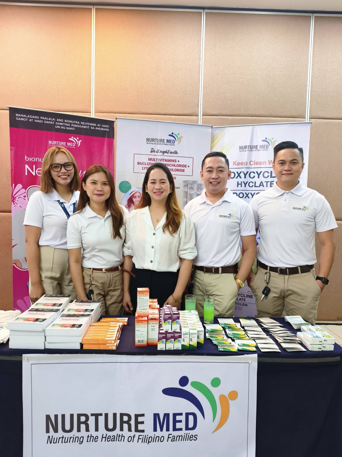 Nurturemed representatives beside a product display at the Southern Philippines Medical Center postgraduate course